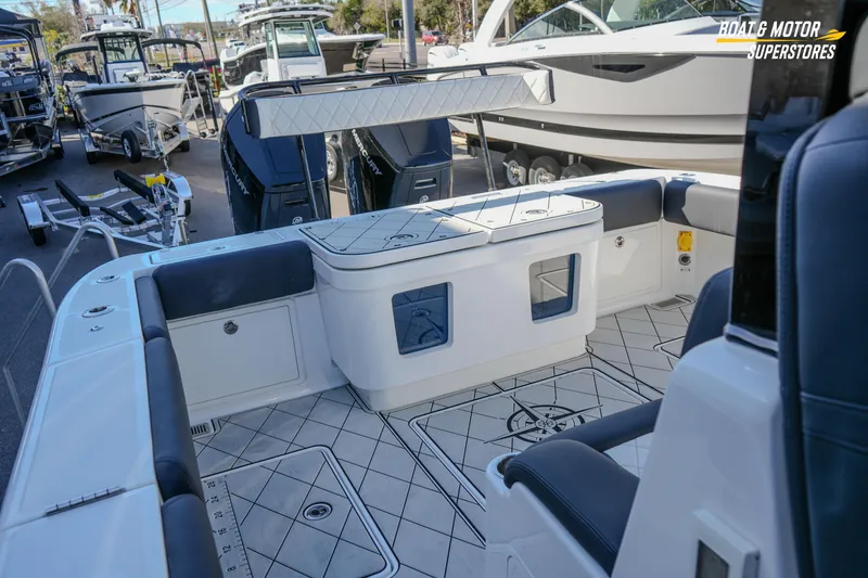 Slide: The Image of 2023 HCB 39 Speciale boat on trailer at dealership under clear blue sky. - 69