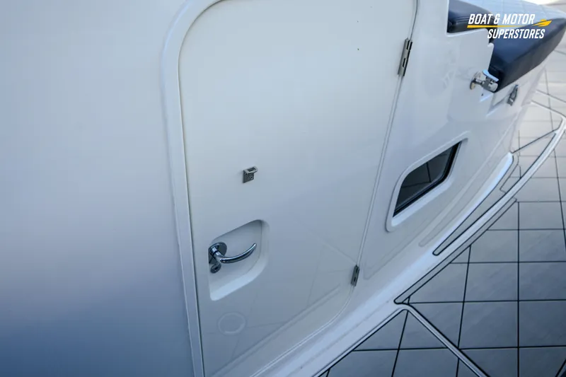 Slide: The Image of 2023 HCB 39 Speciale boat on trailer at dealership, showcasing sleek design and modern features. - 71