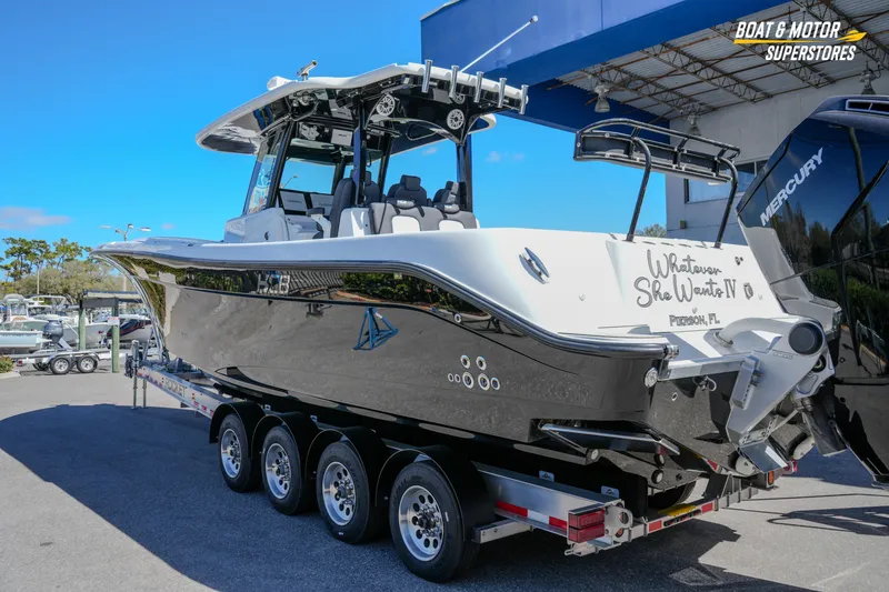 Slide: The Image of 2023 HCB 39 Speciale boat on trailer at dealership, Boat & Motor Superstores. - 76