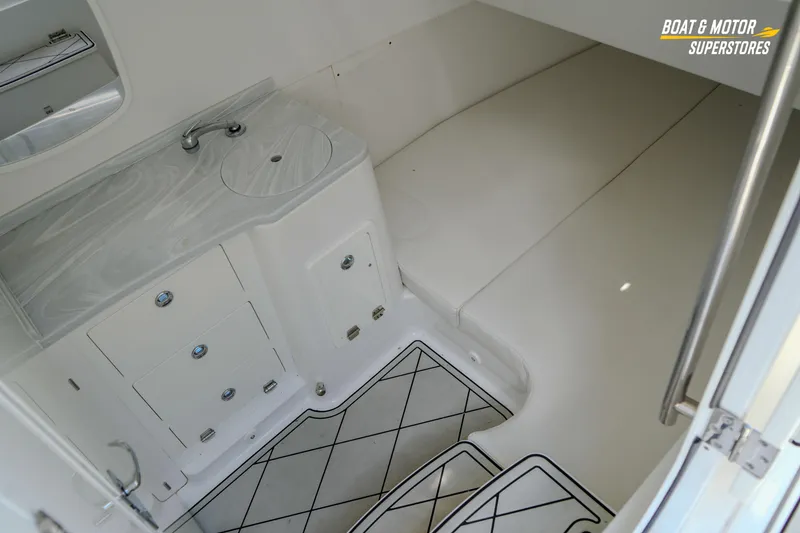 Slide: The Image of 2023 HCB 39 Speciale boat interior with diamond-patterned flooring and cushioned seating. - 87