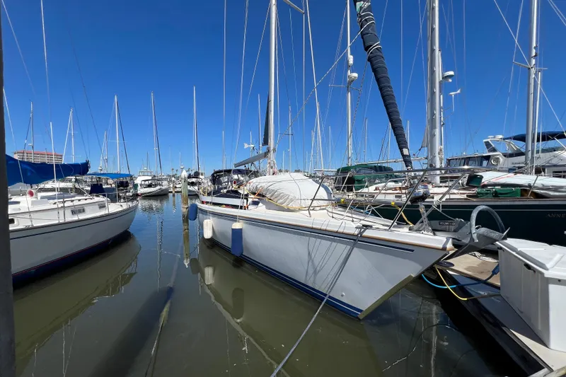 The Image of Sailboat Catalina 42 (1989) docked in sunny marina with blue skies. - 0