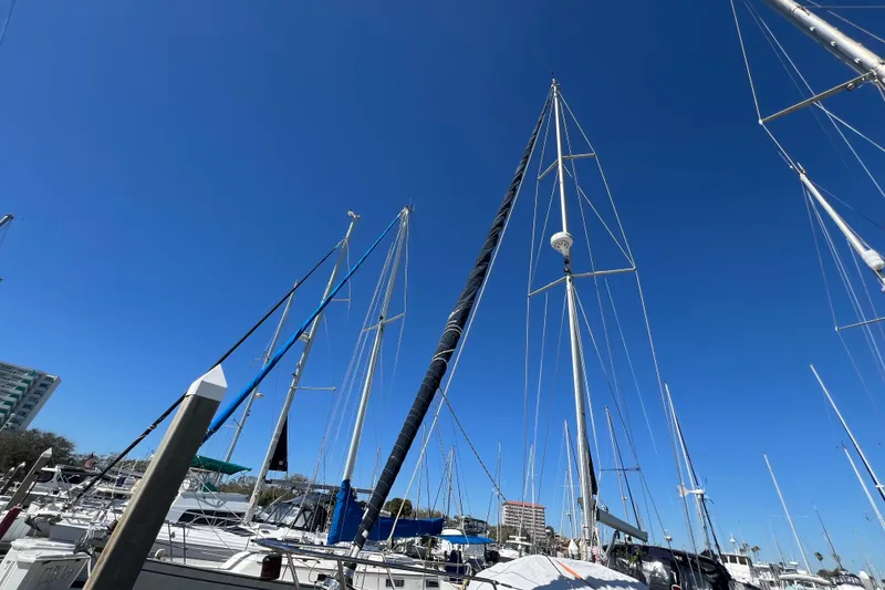Slide: The Image of Sailboat mast and rigging of a 1989 Catalina 42 in a marina. - 10
