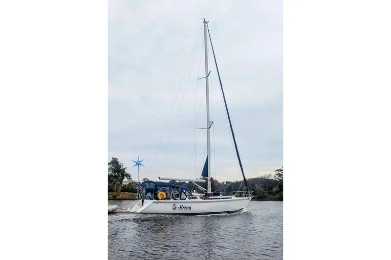 Slide: The Image of Close-up of 1989 Catalina 42 sailboat deck with rigging and blue canvas cover. - 12