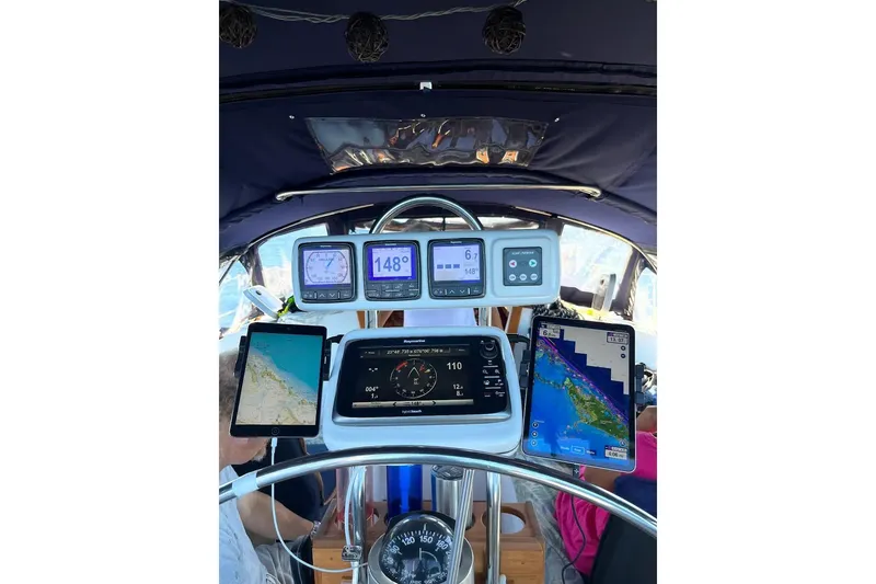 Slide: The Image of Navigation system on 1989 Catalina 42 MkII sailboat displaying radar and coordinates. - 21