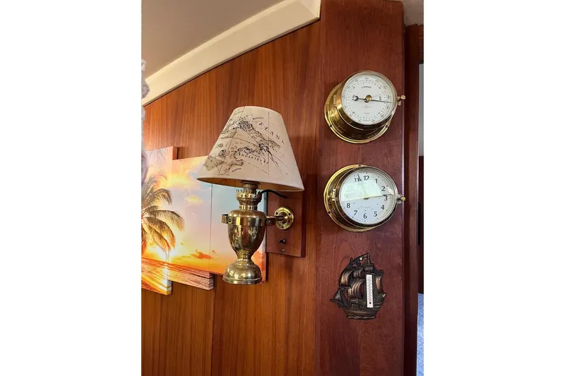 Slide: The Image of Interior of 1989 Catalina 42 MkII sailboat with wooden decor and cozy seating area. - 26