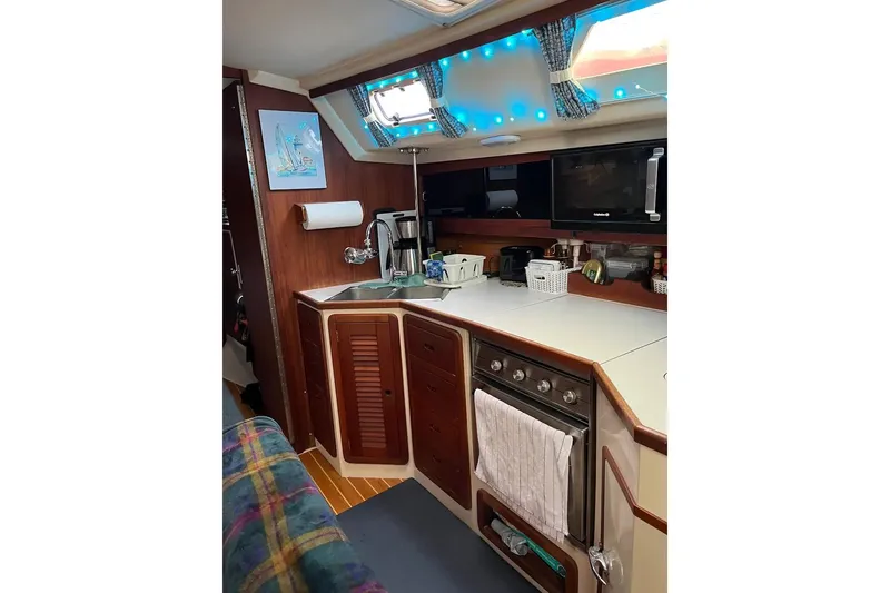 Slide: The Image of Cozy interior of 1989 Catalina 42 MkII sailboat with tropical decor and seating area. - 27