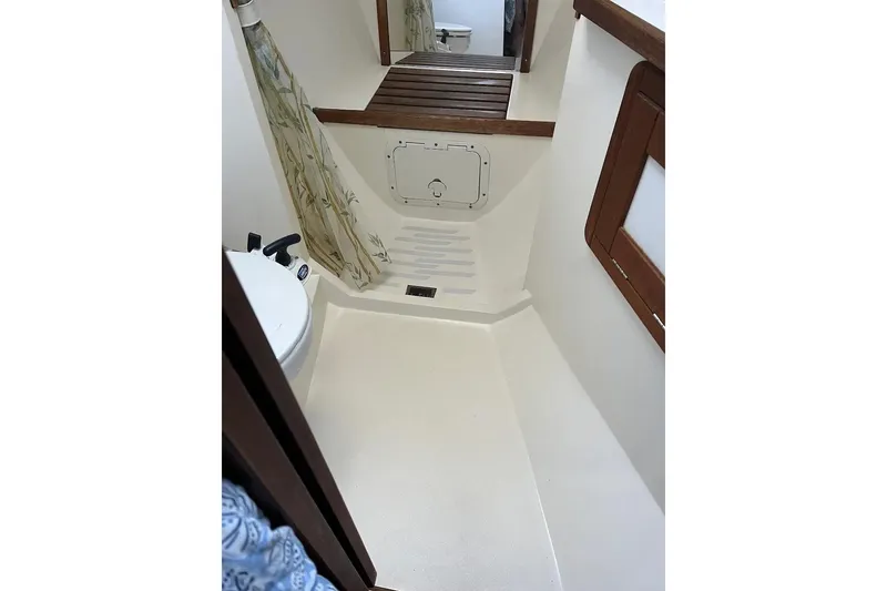 Slide: The Image of Empty wooden closet interior on a 1989 Catalina 42 sailboat. - 41