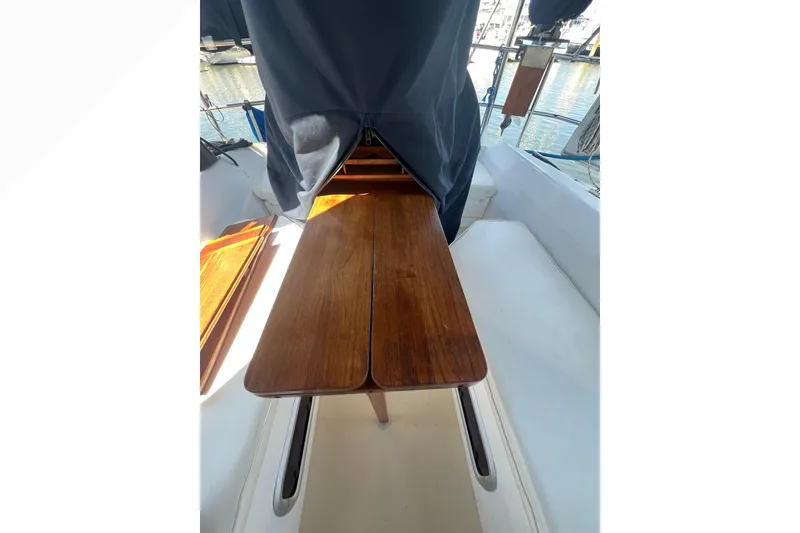 Slide: The Image of Bathroom interior of a 1989 Catalina 42 sailboat with mirror and wooden accents. - 42