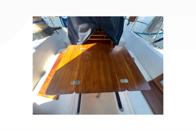 Slide: The Image of Interior of 1989 Catalina 42 sailboat bathroom with shower and wooden accents. - 43