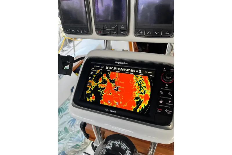 Slide: The Image of Interior of 1989 Catalina 42 sailboat with open hatch and curtains. - 45