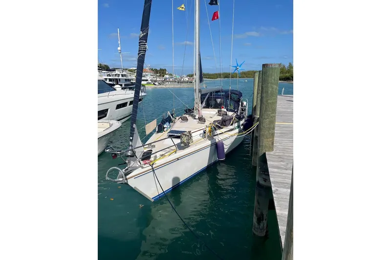 Slide: The Image of Catalina 42 MkII sailboat docked in marina, featuring Lifesling safety equipment. - 5