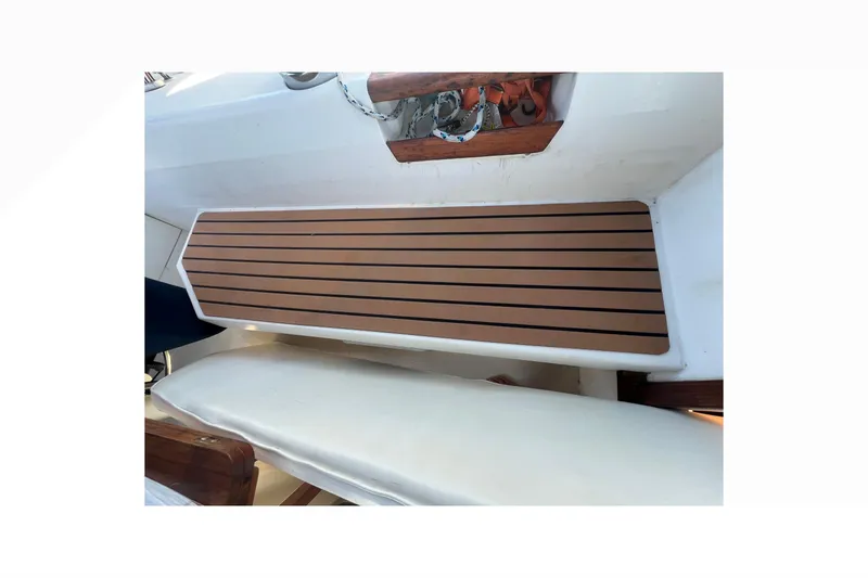 Slide: The Image of Catalina 42 sailboat with dinghy on deck, marina background, sunny day. - 50