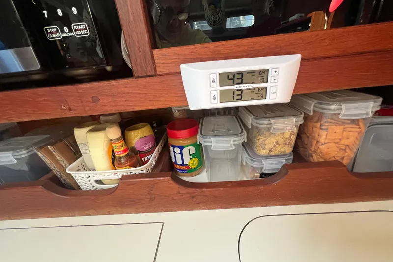 Slide: The Image of Engine compartment of a 1989 Catalina 42 sailboat, showing alternator and belt system. - 64