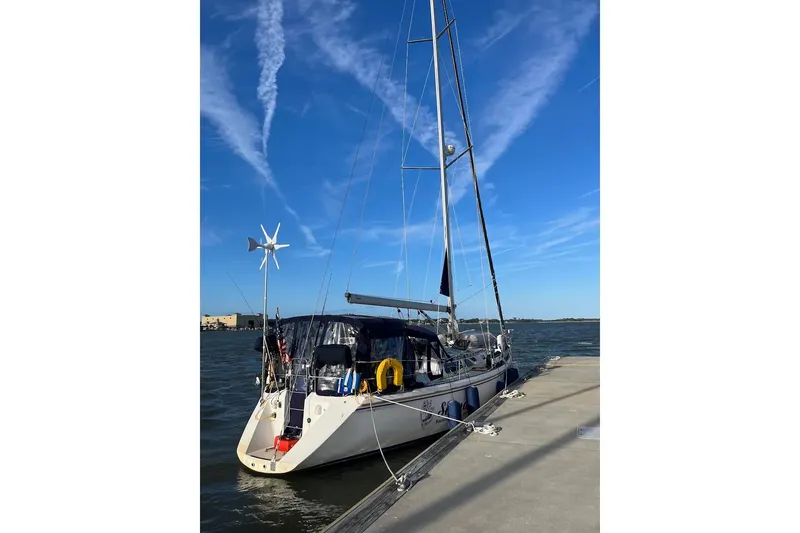 Slide: The Image of Deck of 1989 Catalina 42 sailboat with rigging and potted plant. - 7
