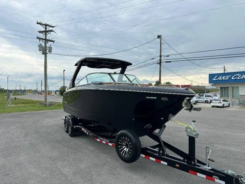 Slide: The Image of 2026 Chaparral SSX 30 boat parked on trailer outdoors. - 18