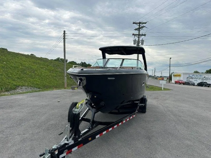 Slide: The Image of 2026 Chaparral SSX 30 boat on trailer, overcast sky. - 24