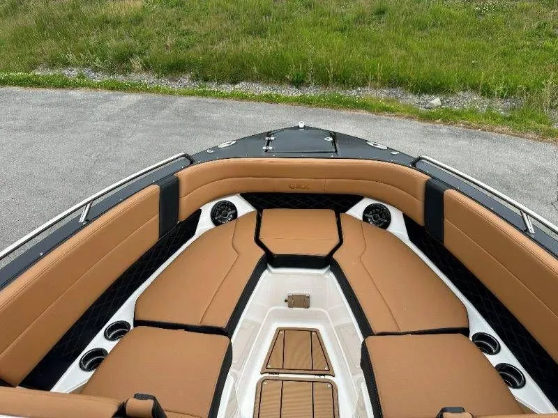 Slide: The Image of Interior of Chaparral SSX 30 boat, 2026 model, featuring brown seating. - 31