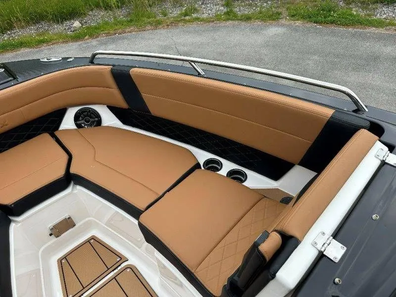 Slide: The Image of Interior of Chaparral SSX 30 boat, 2026 model, featuring brown leather seats. - 35