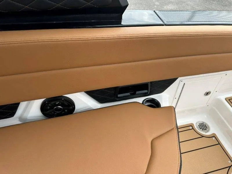 Slide: The Image of Interior of Chaparral SSX 30 boat, 2026 model, featuring brown upholstery. - 36