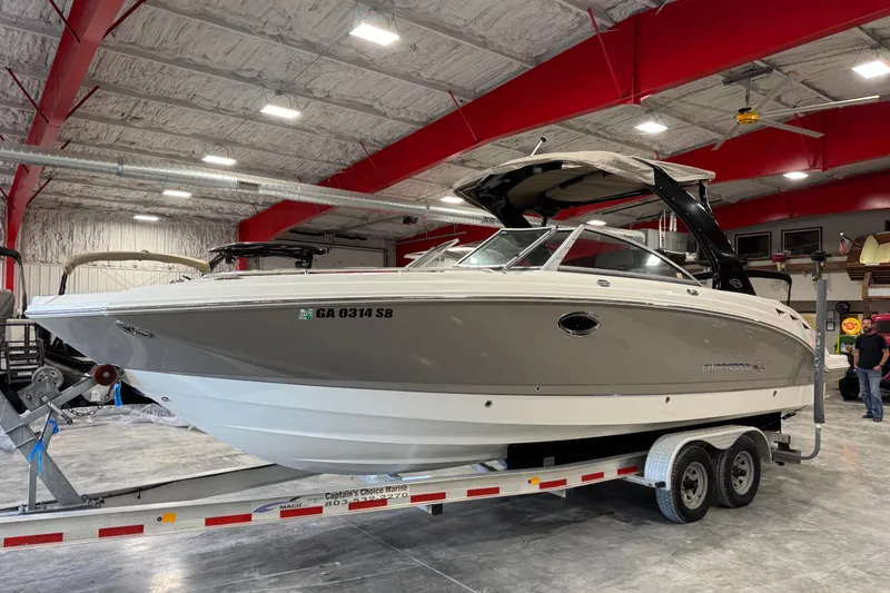 The Image of 2008 Chaparral 284 Sunesta boat on trailer in indoor storage facility. - 1