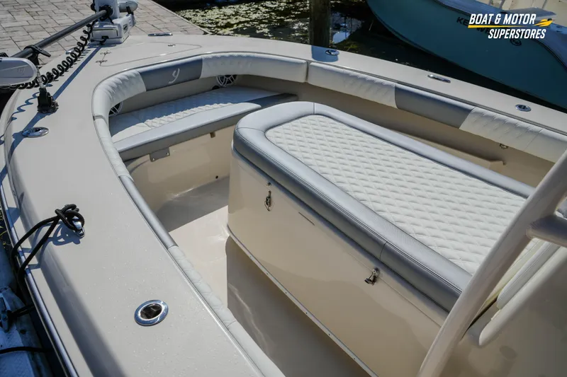 Slide: The Image of Interior of a 2016 Young 27 boat with cushioned seating and storage. - 18