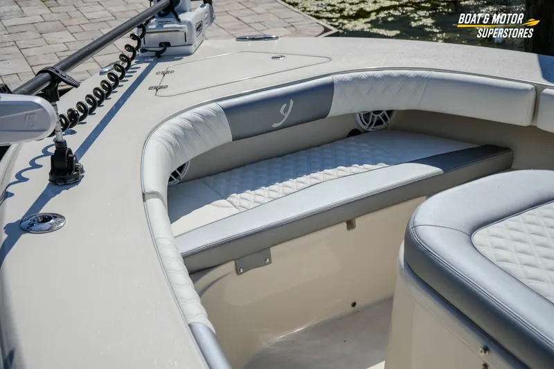 Slide: The Image of Luxurious seating on a 2016 Young 27 boat, featuring quilted upholstery and modern design. - 19