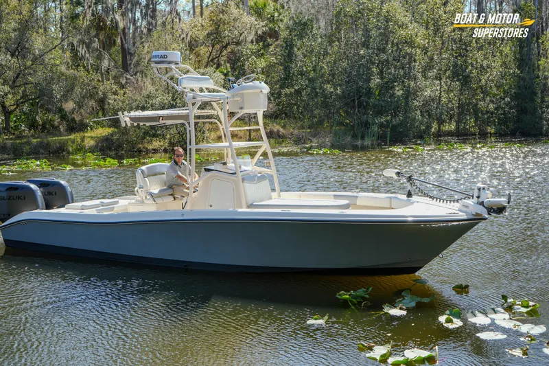 Slide: The Image of Young 27 boat from 2016 on a serene lake, surrounded by lush greenery. - 24
