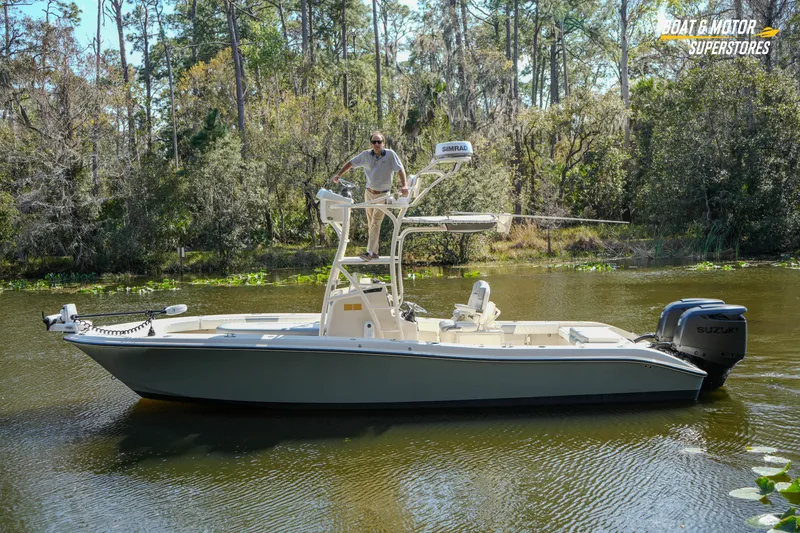 Slide: The Image of Man on 2016 Young 27 boat with Suzuki motor in scenic river setting. - 4