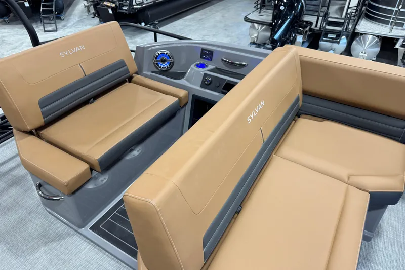 Slide: The Image of 2026 Sylvan G5 boat interior with tan seating and modern dashboard. - 16
