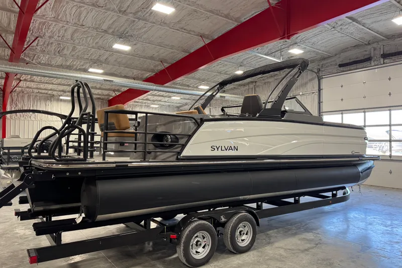 Slide: The Image of 2026 Sylvan G5 pontoon boat in a showroom, featuring sleek design and modern amenities. - 3