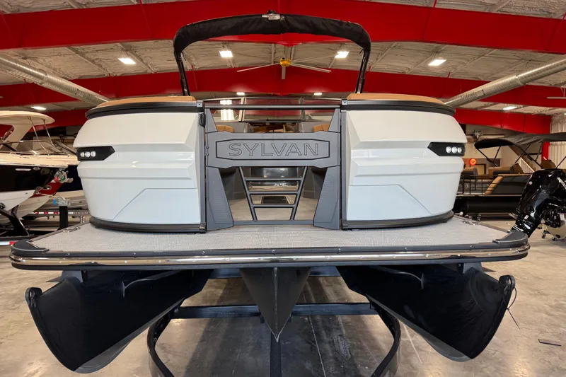 Slide: The Image of 2026 Sylvan G5 pontoon boat in showroom, featuring sleek design and modern amenities. - 4