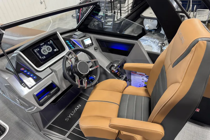 Slide: The Image of 2026 Sylvan G5 boat cockpit with modern steering wheel and control panel. - 6