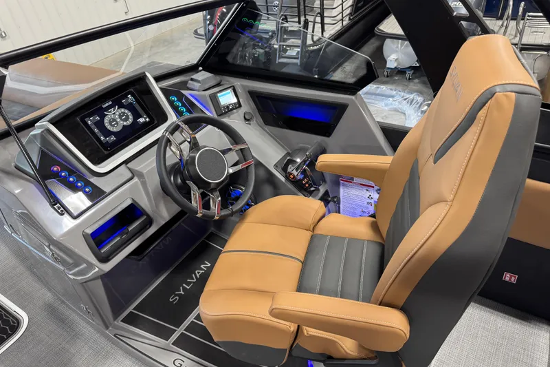Slide: The Image of 2026 Sylvan G5 boat cockpit with modern steering, digital display, and luxurious seating. - 7