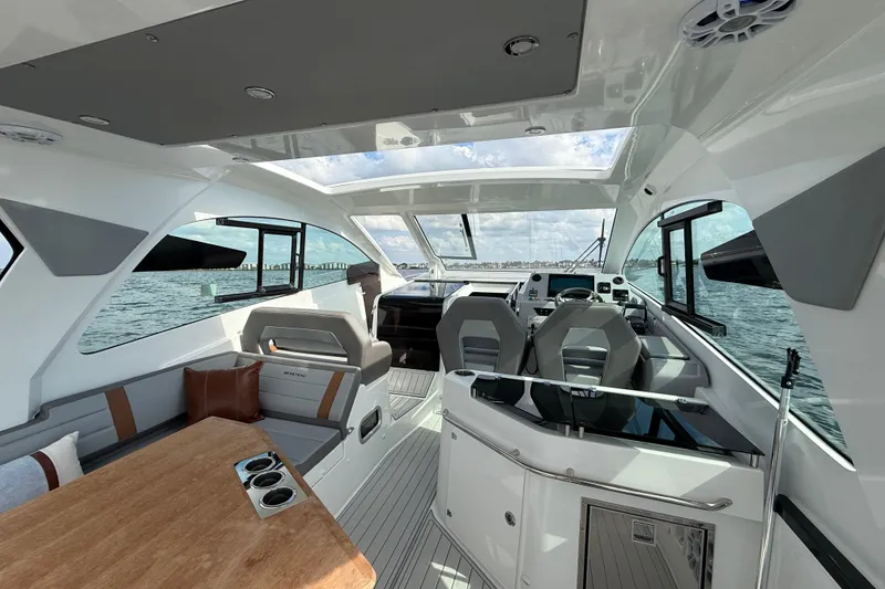 Slide: The Image of Interior of 2025 Beneteau Gran Turismo 32 yacht, featuring modern seating and sleek design. - 10