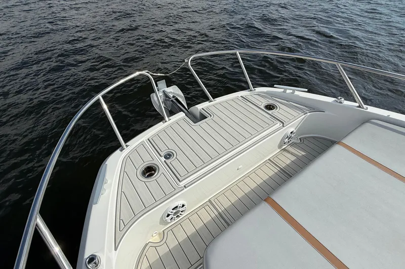Slide: The Image of 2025 Beneteau Gran Turismo 32 boat deck with sleek design on calm water. - 23
