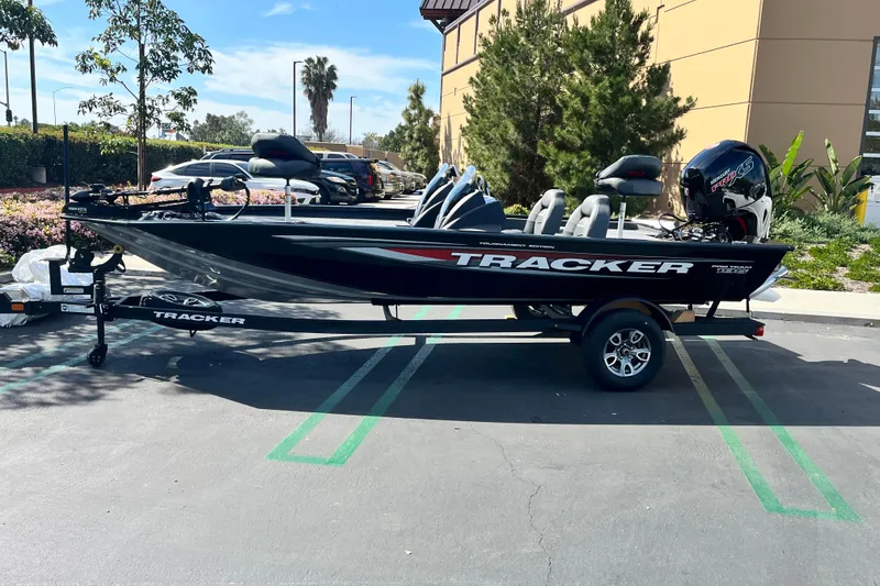 Slide: The Image of 2026 Tracker Pro Team 195 boat parked outdoors, featuring sleek design and modern equipment. - 58