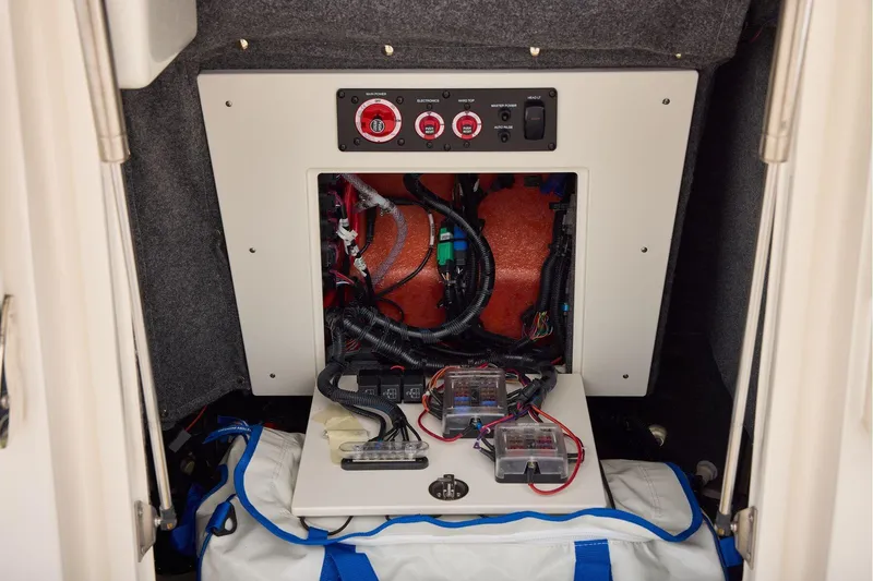 Slide: The Image of Electrical panel inside 2026 Mako 24 APEX boat, showcasing wiring and components. - 34