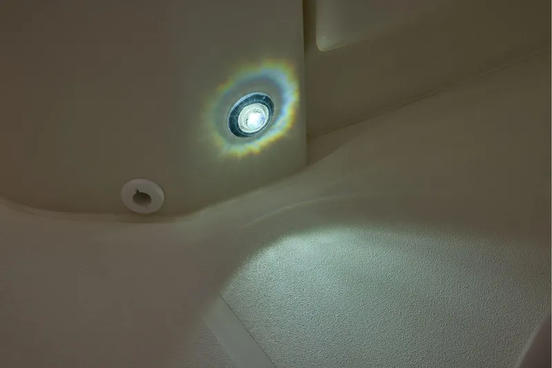 Slide: The Image of LED light detail on 2026 Mako 24 APEX boat interior. - 48