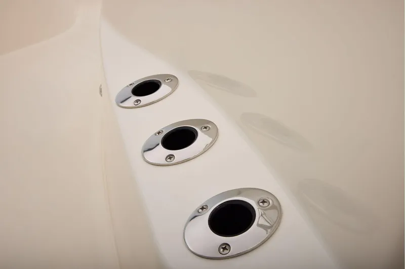 Slide: The Image of Close-up of 2026 Mako 24 APEX boat rod holders on sleek white surface. - 23