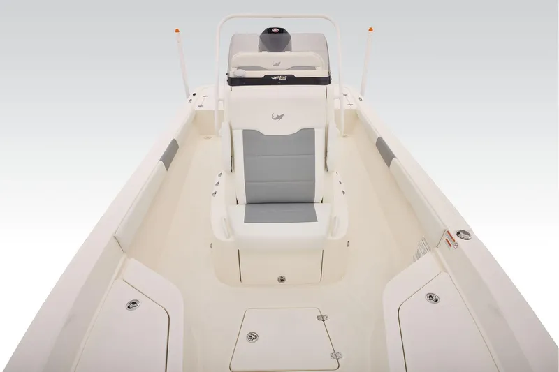 Slide: The Image of 2026 Mako 24 APEX boat interior with sleek seating and storage compartments. - 19
