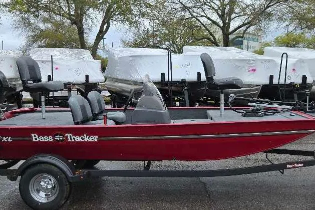 The Image of 2026 Tracker Bass Tracker Classic XL boat in red, parked outdoors on a trailer. - 0