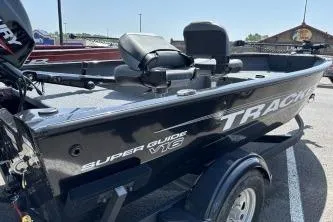 Slide: The Image of 2026 Tracker Super Guide V-16 T boat in parking lot, featuring sleek design and comfortable seating. - 4