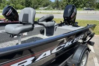Slide: The Image of 2026 Tracker Super Guide V-16 T boat with dual seats and outboard motor. - 3