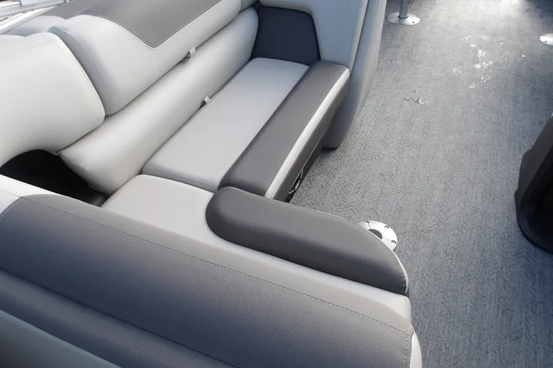 Slide: The Image of Interior seating of 2026 Sun Tracker Fishin' Barge 20 DLX, featuring gray upholstery. - 14