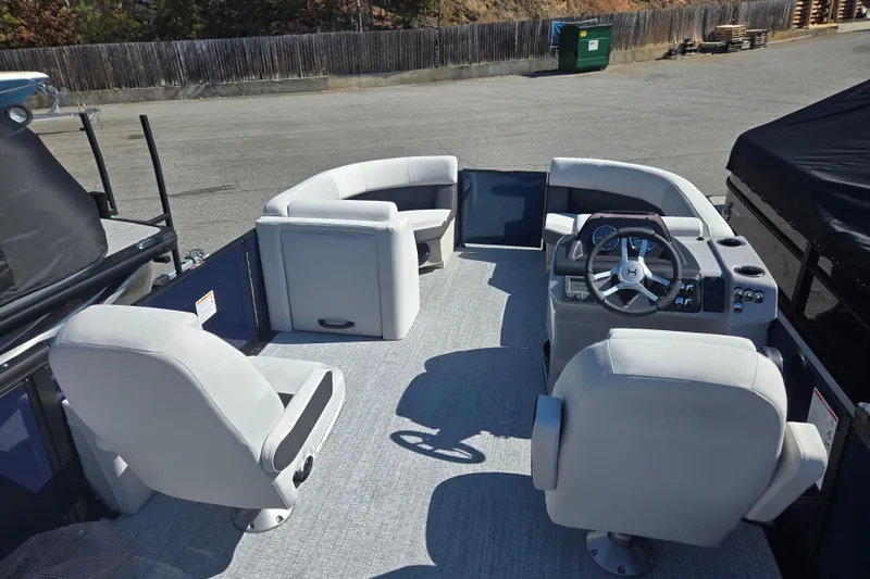 Slide: The Image of 2026 Harris Cruiser 210 SLDH pontoon boat interior with modern seating and steering wheel. - 5