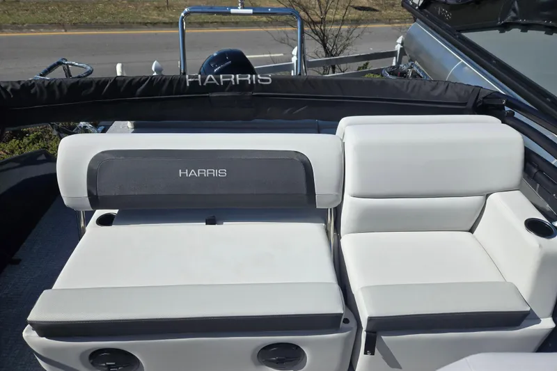 Slide: The Image of 2026 Harris Cruiser 210 SLDH boat interior with white seating and branded backrest. - 7