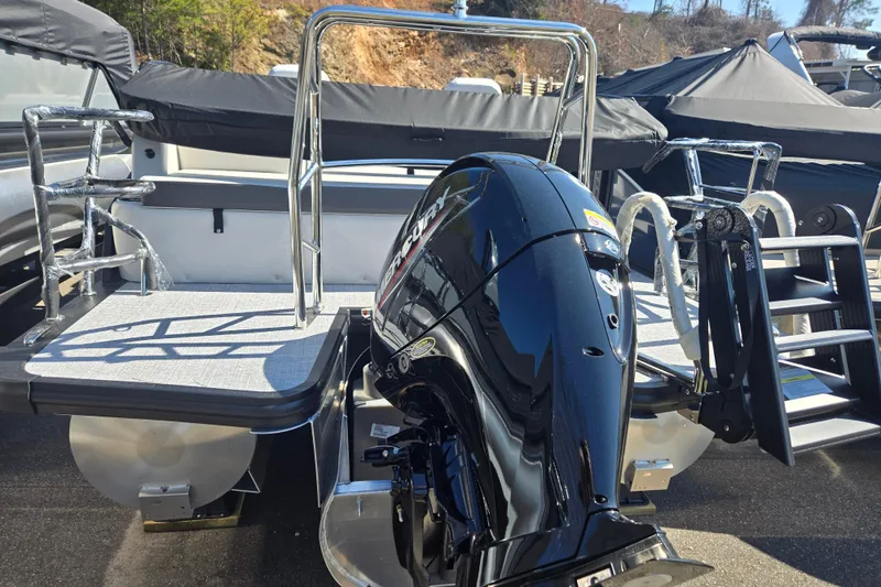 Slide: The Image of 2026 Harris Cruiser 210 SLDH pontoon boat with powerful outboard motor and sleek design. - 8