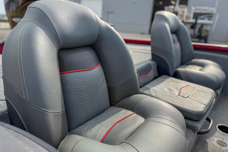 Slide: The Image of 2023 Tracker Pro Team 175 TXW Tournament Edition boat seats, gray with red accents. - 5
