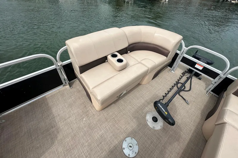 Slide: The Image of 2019 SunCatcher SF 22 XP3 pontoon boat interior with beige seating and trolling motor. - 10