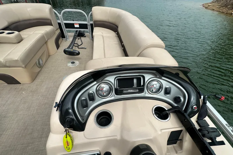 Slide: The Image of 2019 SunCatcher SF 22 XP3 pontoon boat interior with beige seating and control panel. - 17